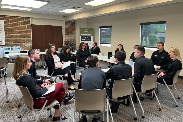 Trust Point Young Professionals working together in a group