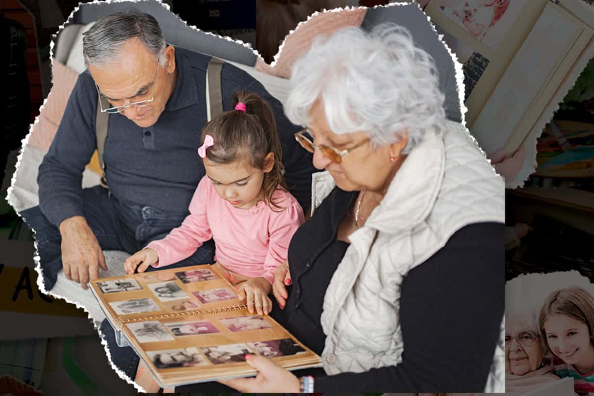 Retired Couple looking at photo book with grandaughter