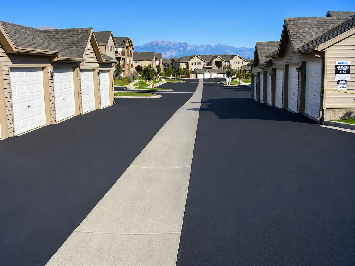 Freshly sealcoated residential asphalt drive lanes at a Utah apartment complex