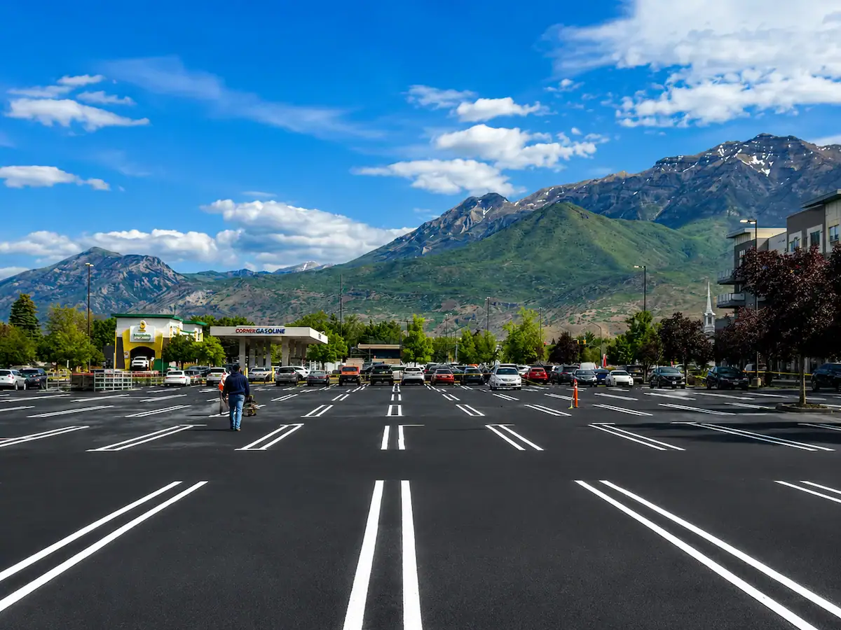 Freshly striped commercial parking lot with Utah mountains in the background