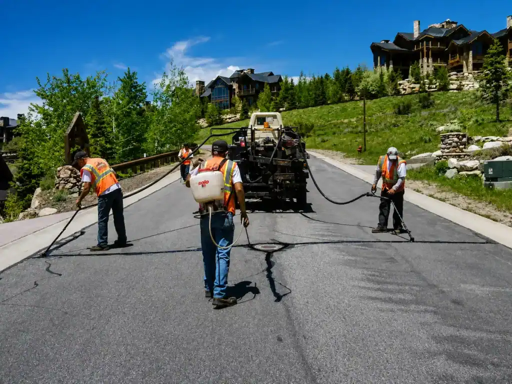 Residential road crack sealing project in a Utah mountain community