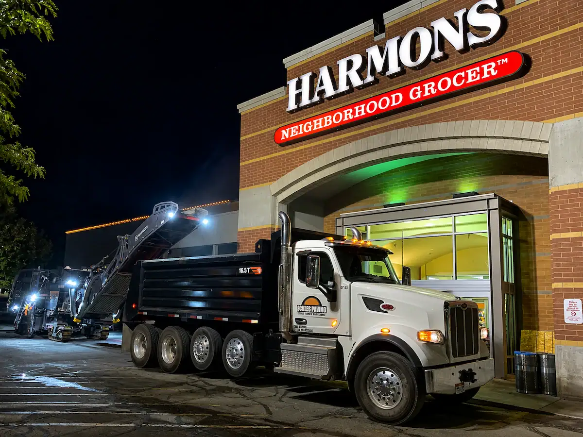 Nighttime asphalt milling project at a Utah grocery store parking lot