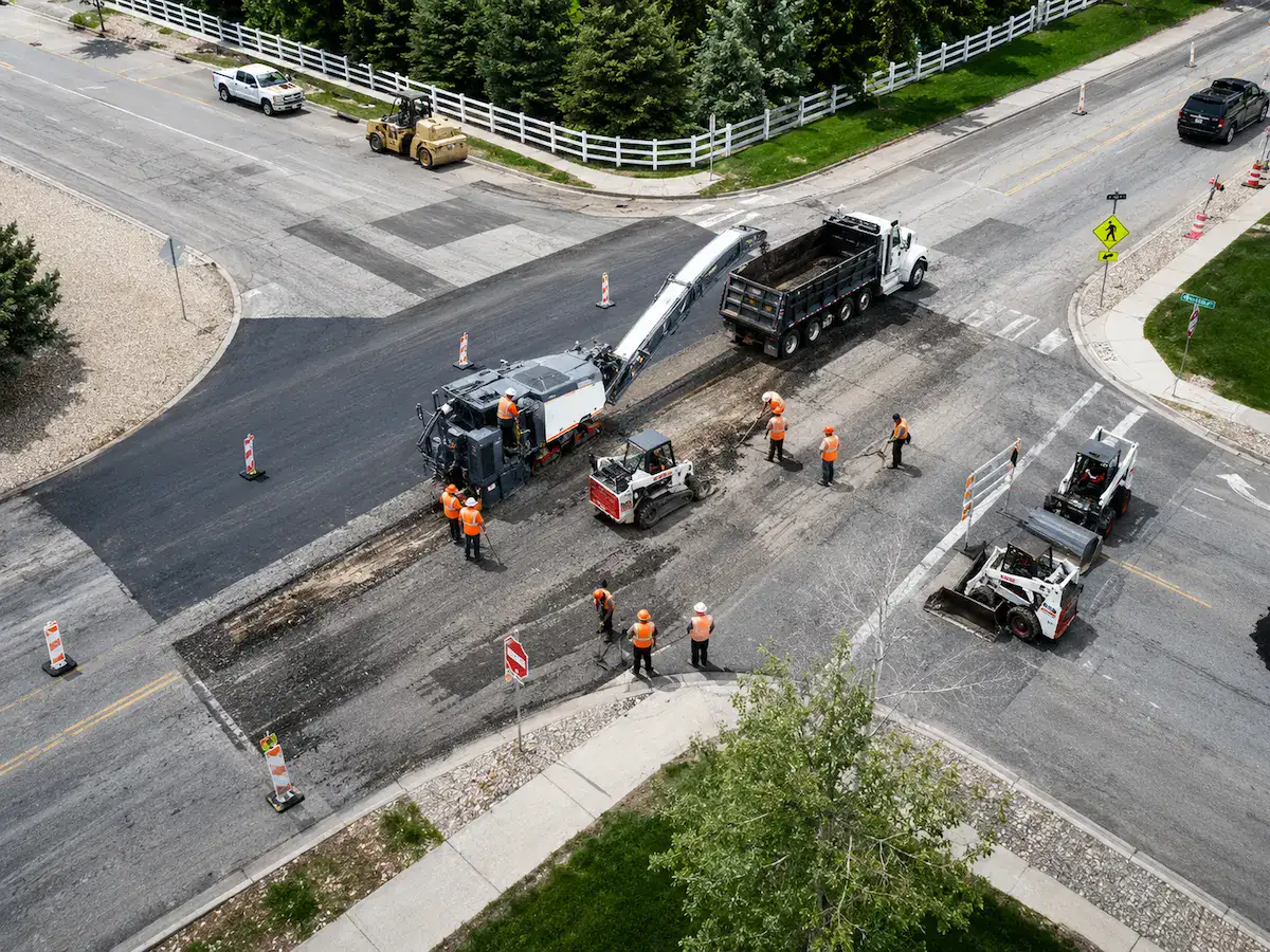 Aerial view of asphalt milling operations at a Utah roadway intersection