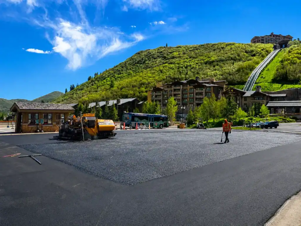 Asphalt paving crew completing a parking lot paving project at a Utah mountain resort property.