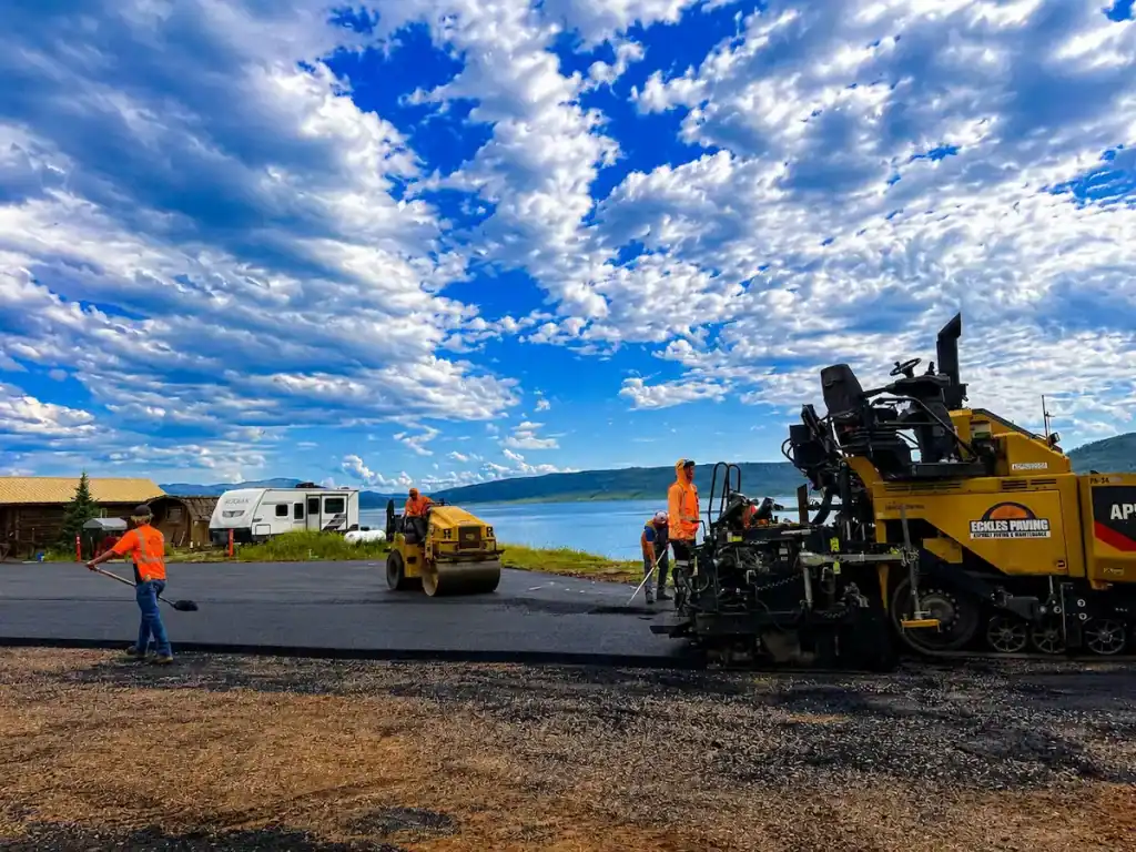 Asphalt paving crew installing new pavement at Strawberry Reservoir in Utah during a 14,000-square-foot paving project by Eckles Paving.