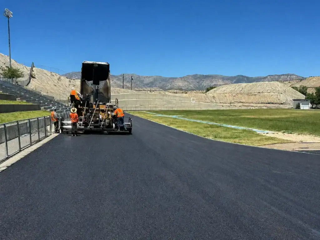Eckles Paving crew installing new asphalt around the track at Carbon High School in Price, Utah.