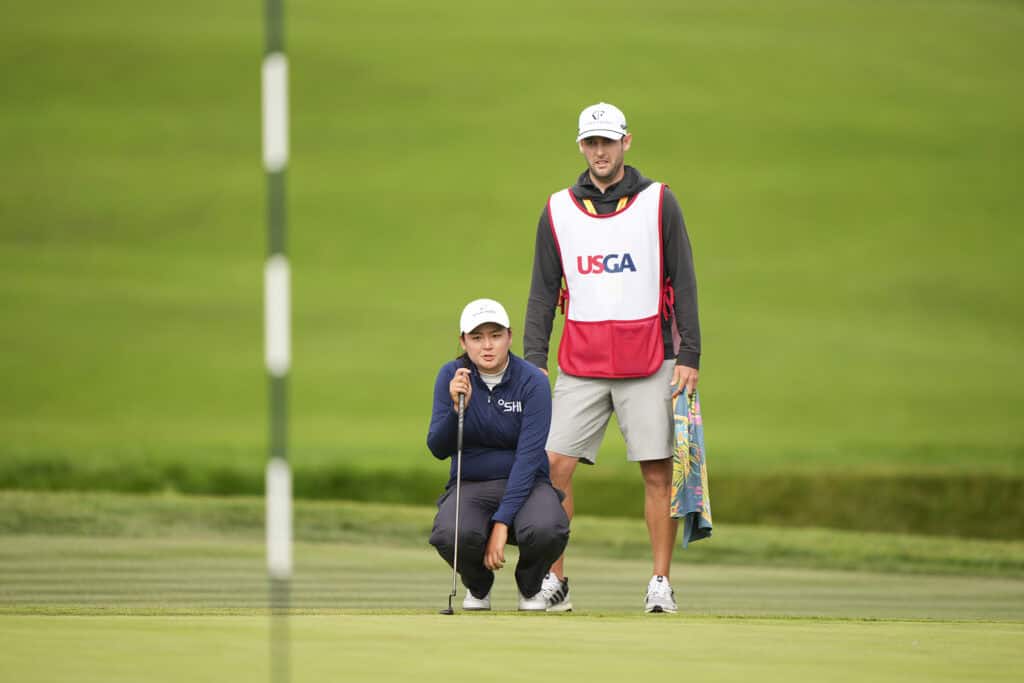 Allisen Corpuz with her caddie Jay Monahan on the 16th green during the final round at the 2023 U.S. Women's Open at Pebble Beach Golf Links in Pebble Beach, Calif. on Sunday, July 9, 2023. (Darren Carroll/USGA)