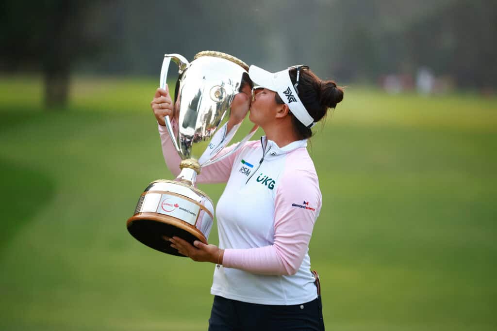 VANCOUVER, BRITISH COLUMBIA - AUGUST 27: Megan Khang of the United States kisses the trophy after winning the CPKC Women's Open at Shaughnessy Golf and Country Club on August 27, 2023 in Vancouver, British Columbia. (Photo by Vaughn Ridley/Getty Images)