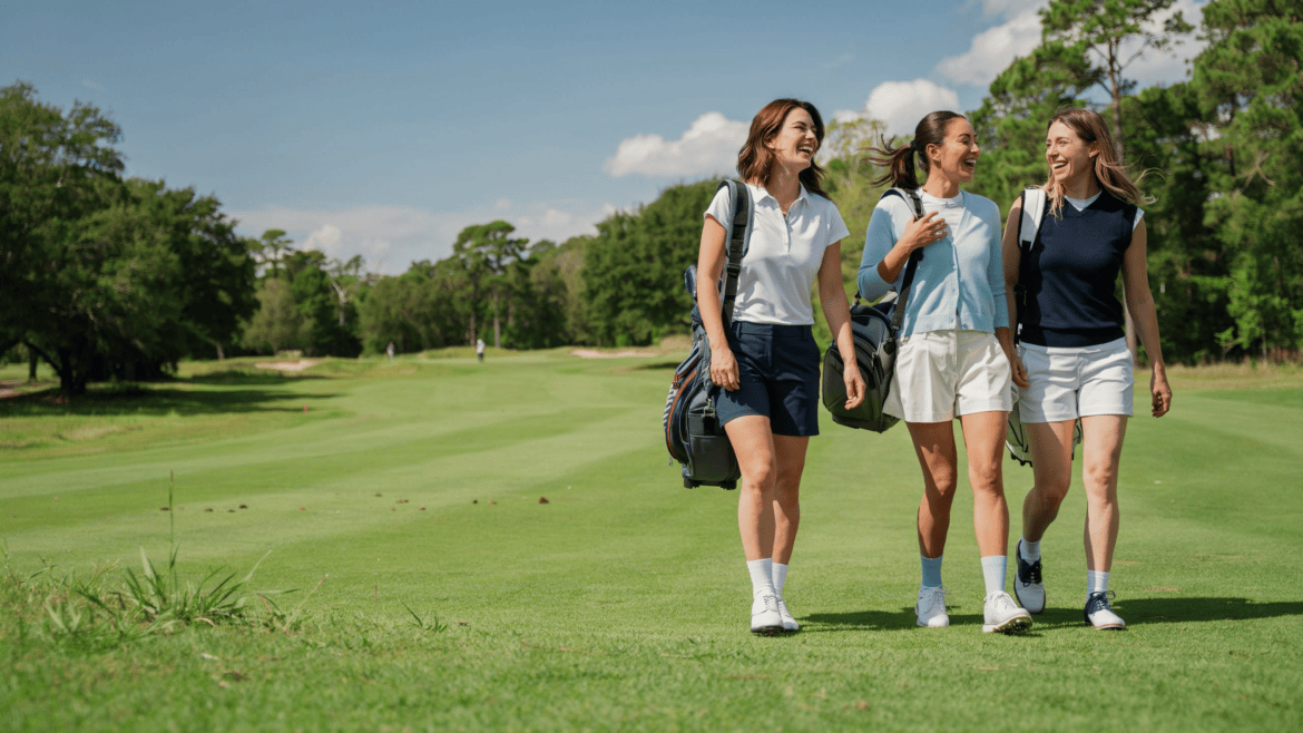 Three women golfer walking on a golf course