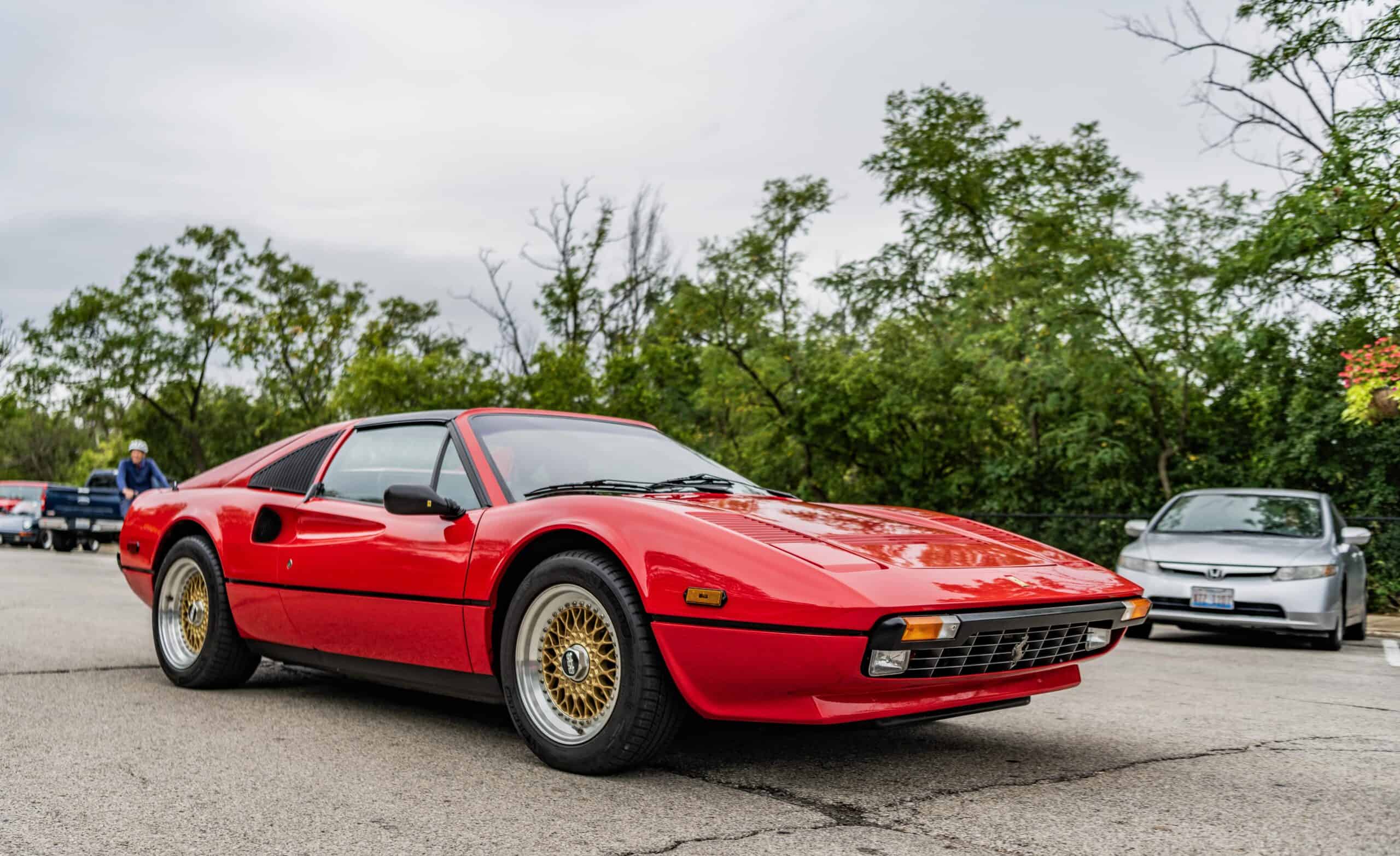 Red Ferrari 308 in parking lot
