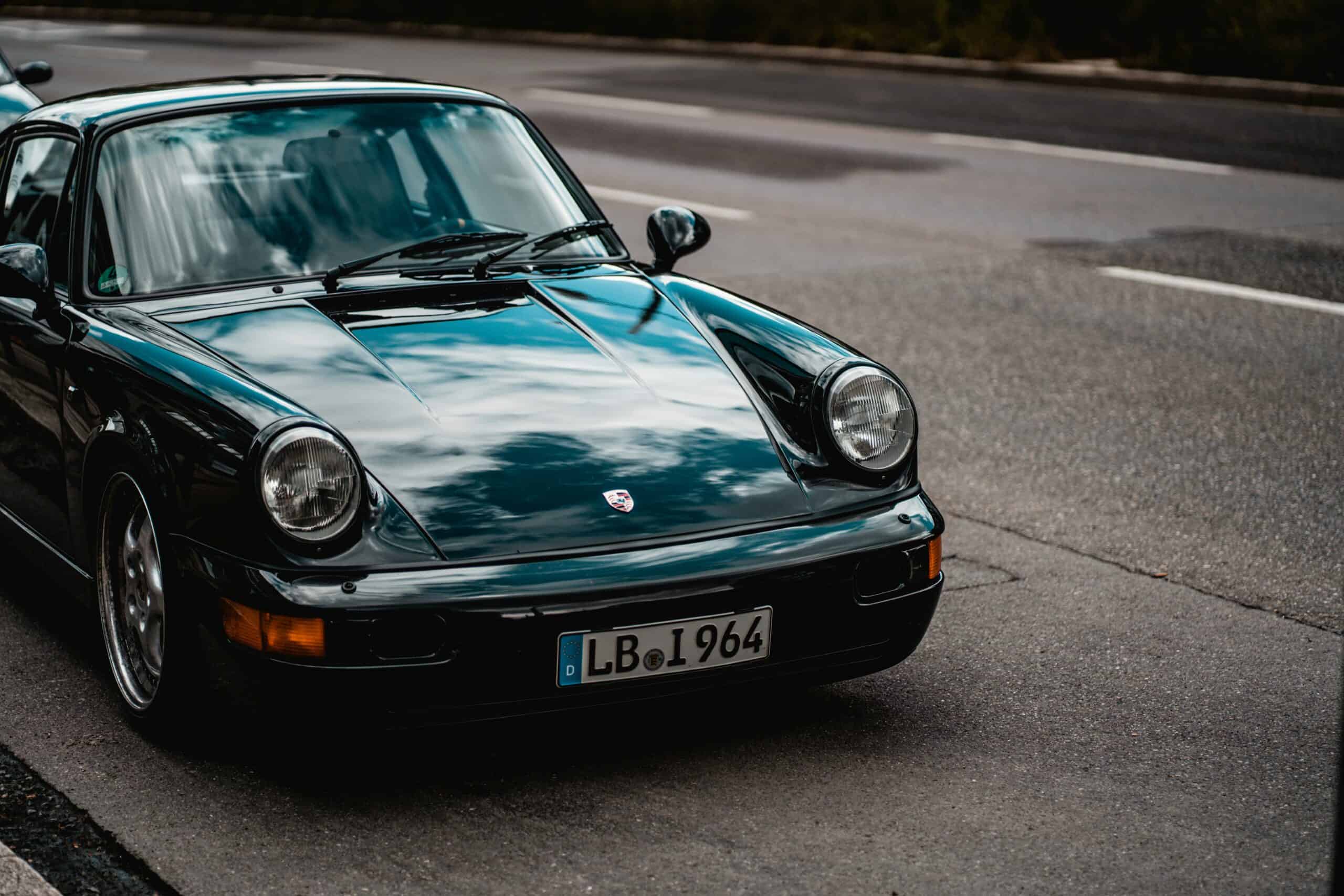 3 quarter turn view of green porsche