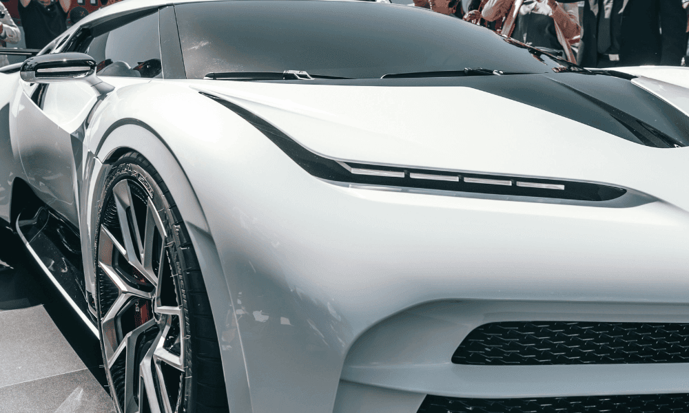 white bugatti at car show celebrity woodside credit