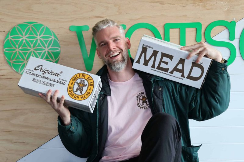 Tim Engelbrecht, founder of Greedy Bear, with a couple of boxes of his creation at WOTSO Cremorne