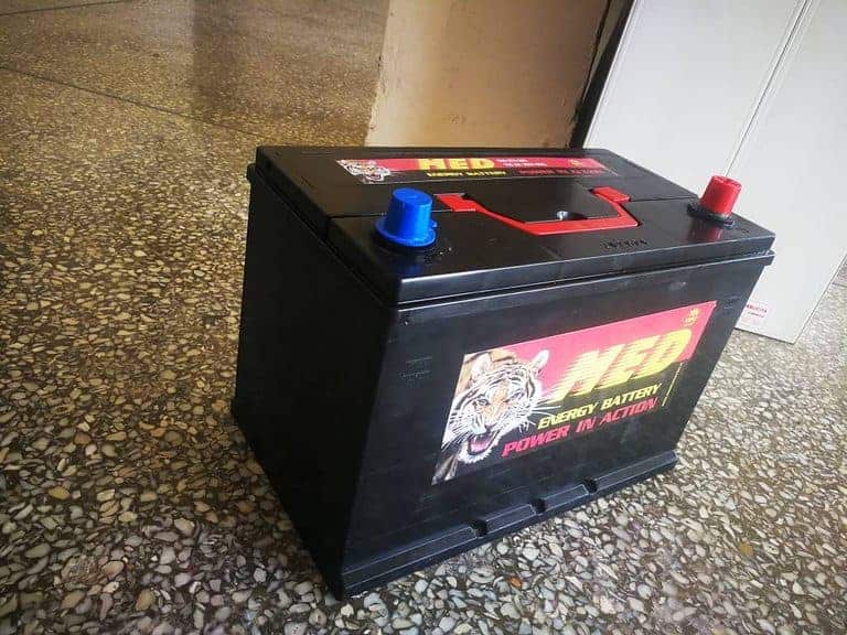 A car battery with a tiger on it.
