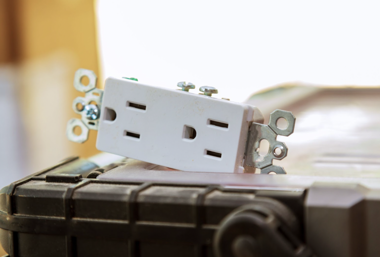 Receptical our outlet laying on counter before finding placement in home or business
