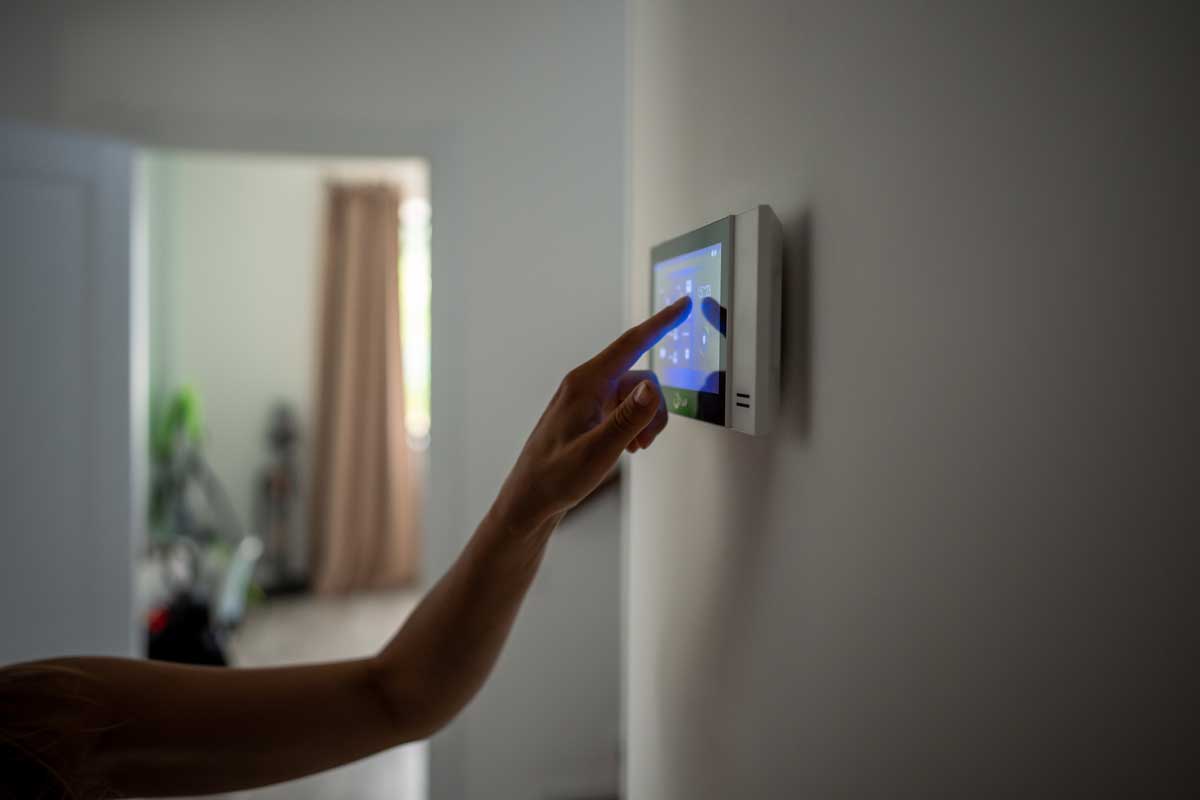 Closeup Hand Using Smart Home Panel Touching Screen