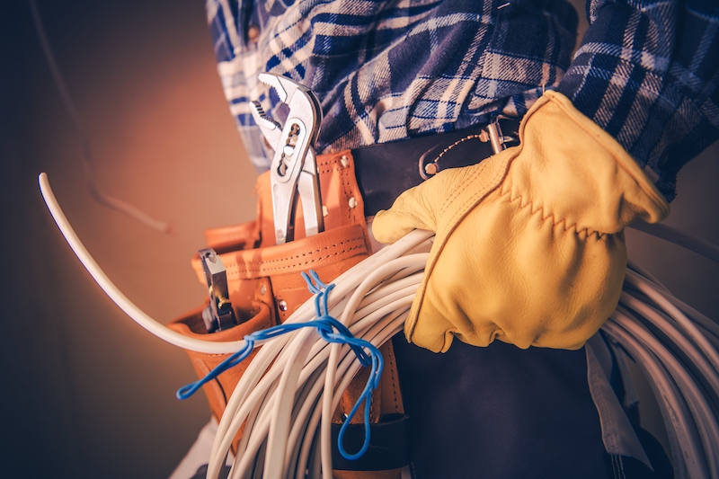 Electrician With Electric Cable practicing electrical safety