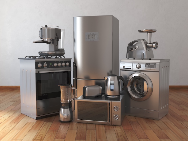 Home Appliances. Household Kitchen Technics In The Empty Room that may require a dedicated circuit or dedicated outlet for electric