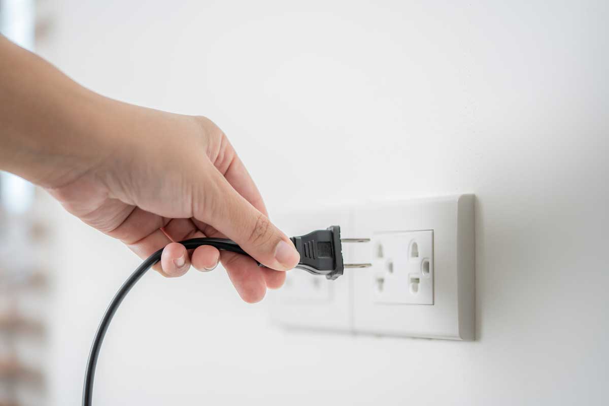 Human Hand Put In Or Out Electric Plug In The Socket