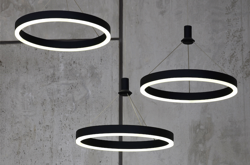 LED Light Sources Hang On The Background Of A Marble Wall. Lamps In The Form Of A Luminous Ring in Minnesota