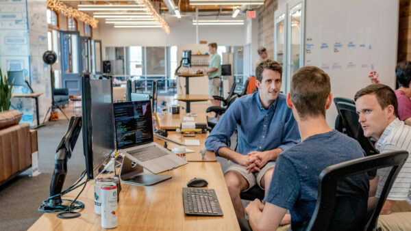 A team working together in a large open plan office