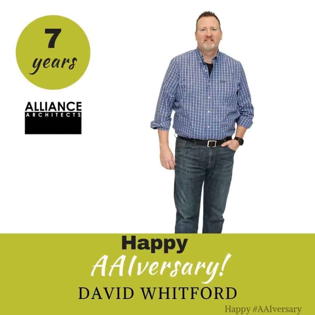 Man celebrates 7 years at Alliance Architects.
