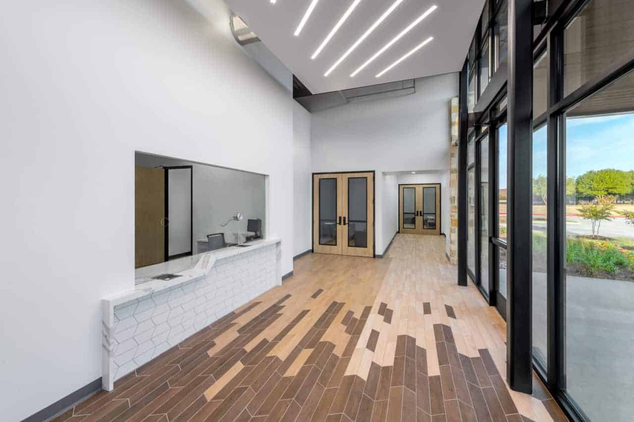 Modern office lobby with wooden flooring