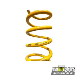 Coil spring used in industrial equipment and heavy machinery applications. Durable yellow coil sprin.