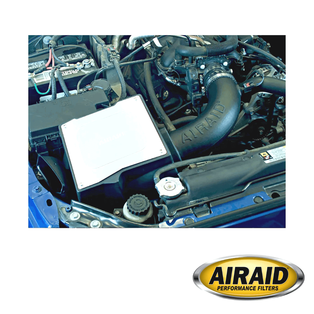 Car engine with AIRAID performance filter and components.