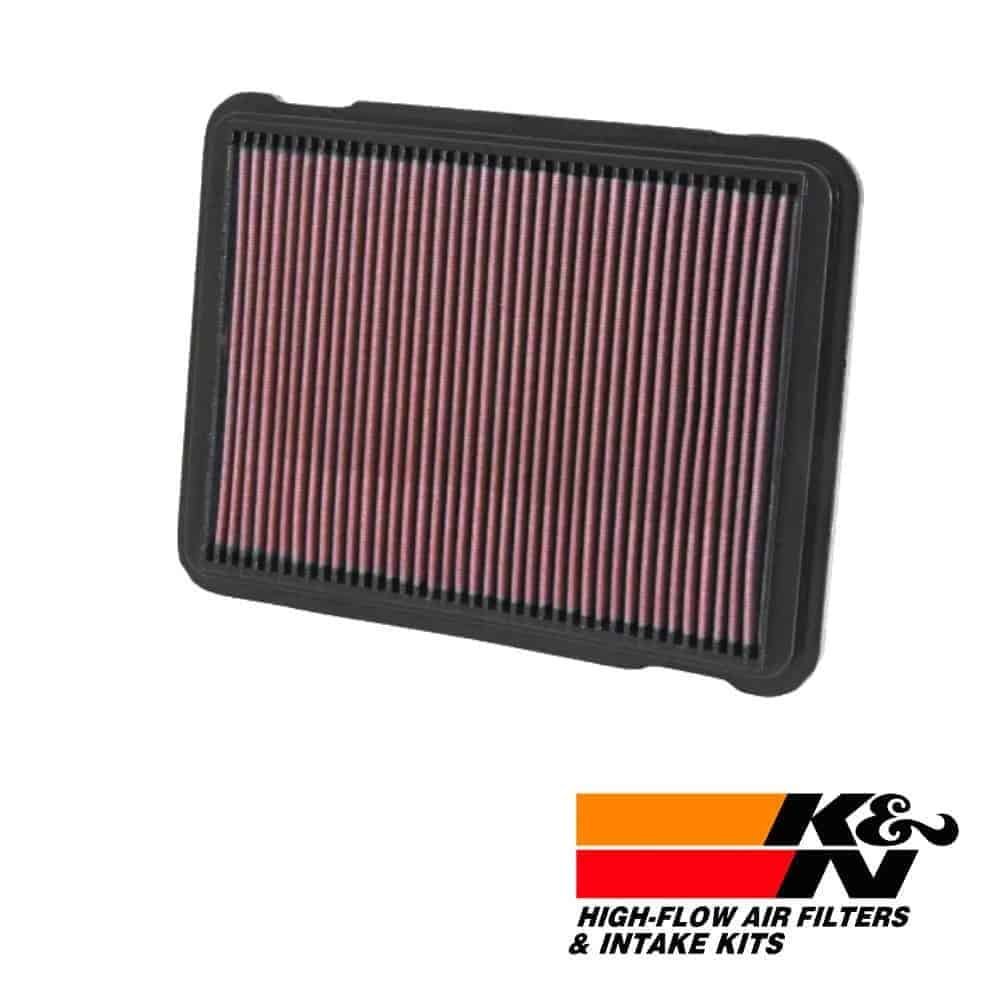 High-flow air filter for vehicle engine, K&N branded, durable and efficient filtration system.
