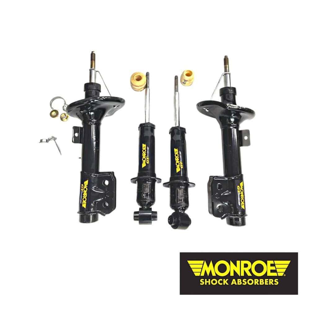 Monroe shock absorbers for vehicle suspension system, black with yellow branding.
