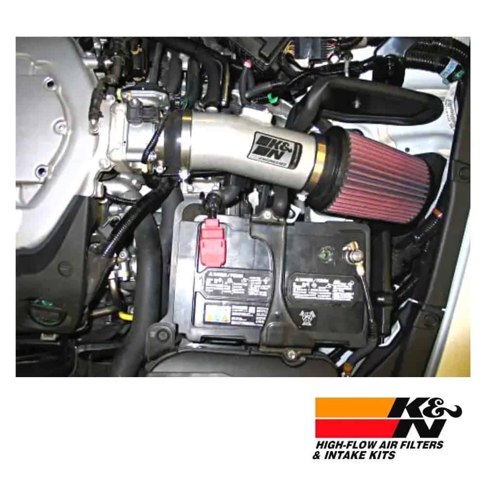 High-performance K&N air intake system with filter installed in a vehicle engine bay.