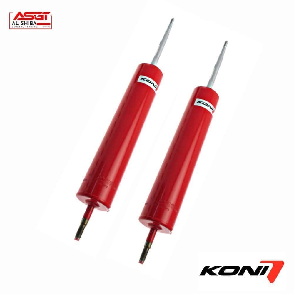 KONI shock absorbers for vehicle suspension systems, red color, high-performance automotive parts.