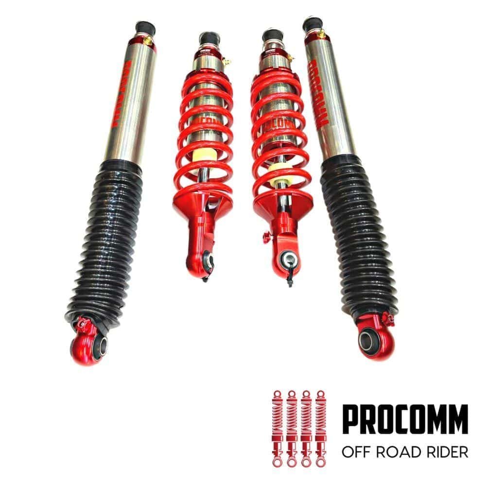 Off-road shock absorbers with red coil springs for vehicle suspension.