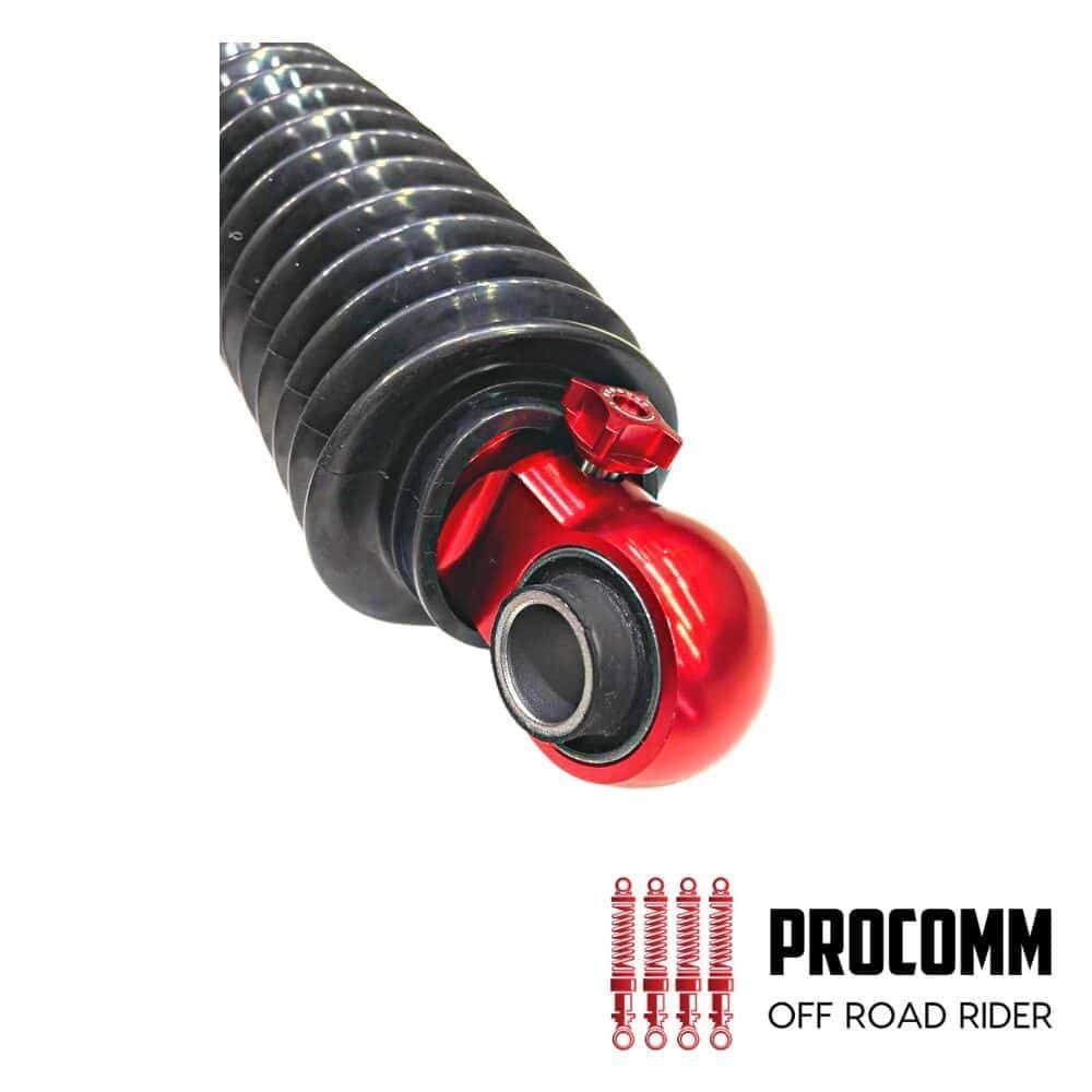 Off-road motorcycle shock absorber with red coil spring and black body.