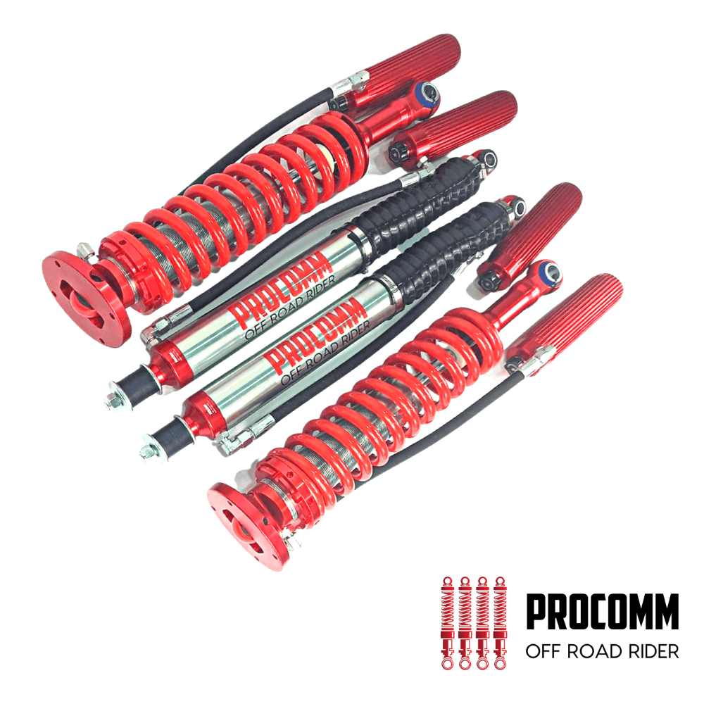 Red off-road shock absorbers for vehicles, high-performance suspension components.