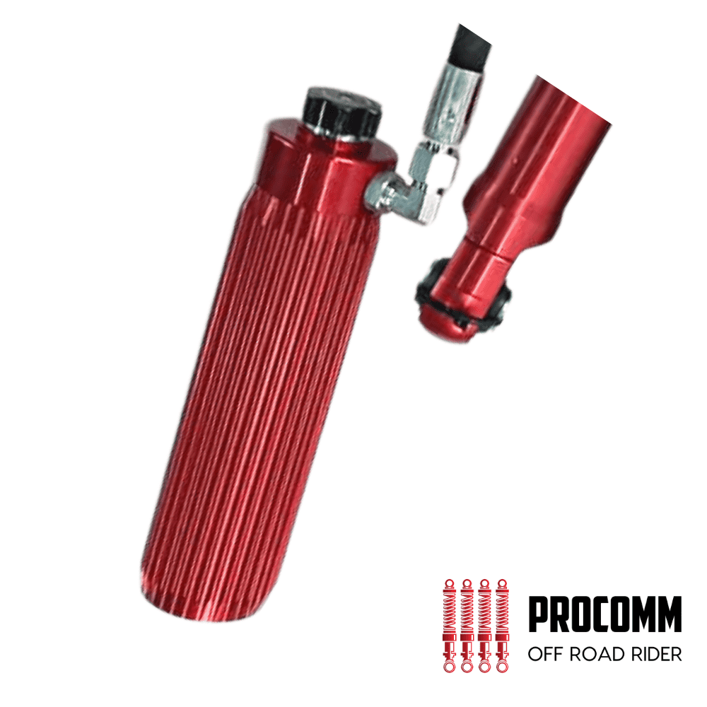 Red off-road motorcycle shock absorber for rugged terrain.