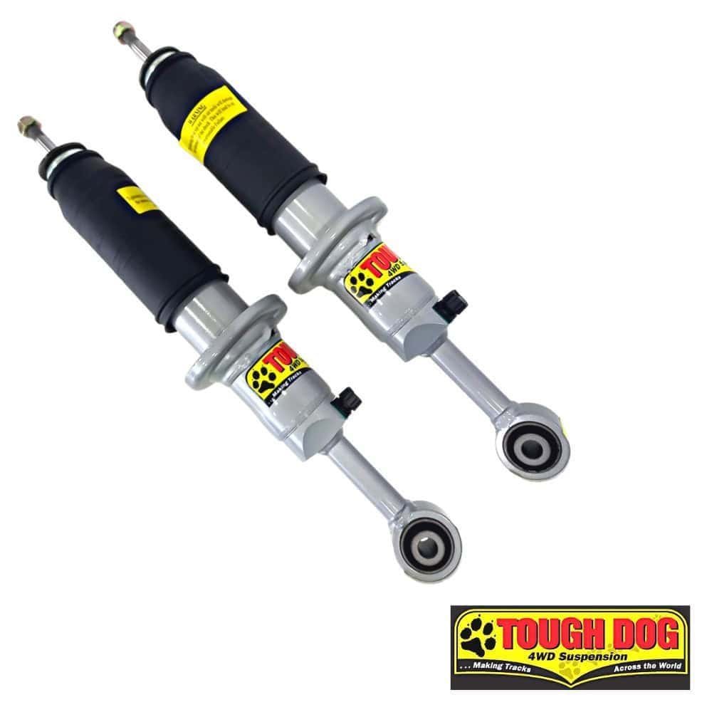 Heavy-duty Tough Dog 4WD suspension shocks for off-road vehicles.