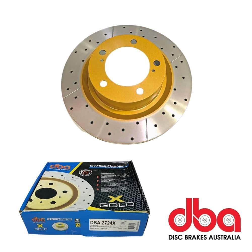 High-performance disc brake rotor for automotive applications, gold-colored, with packaging from DBA.
