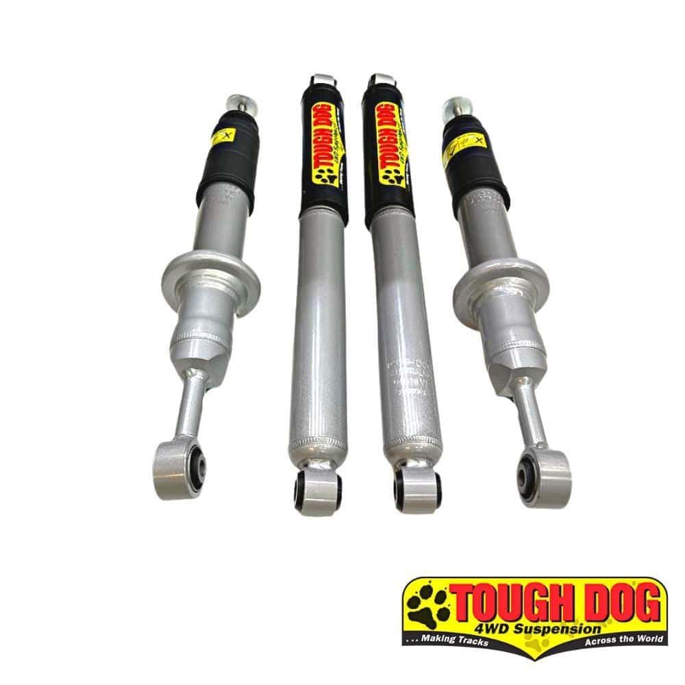 Shock absorbers for 4WD vehicles, branded Tough Dog, displayed in a row.