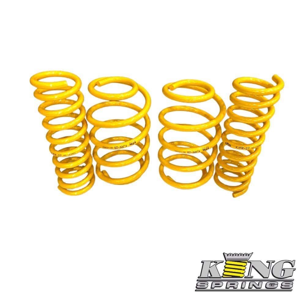 Yellow coil springs for automotive suspension, high-quality and durable.