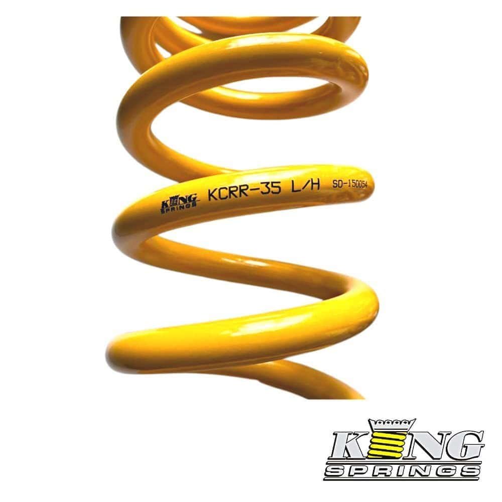High-quality yellow coil spring for industrial and automotive applications.