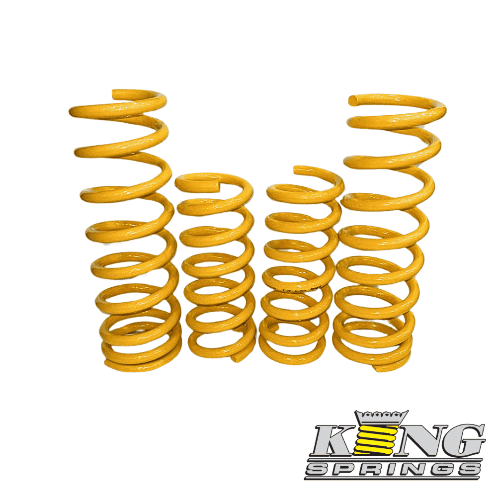 Yellow coil springs for automotive suspension, high-quality and durable.