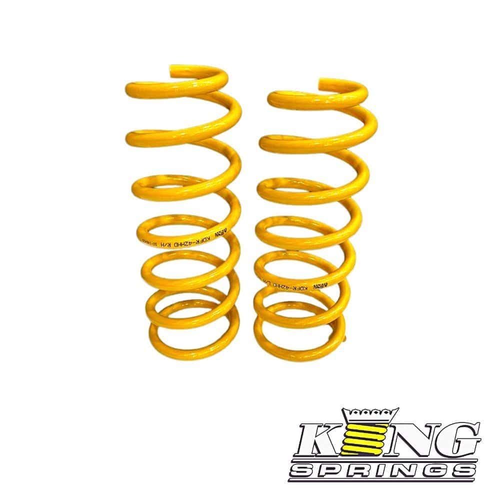 High-quality yellow coil springs for automotive suspension systems.