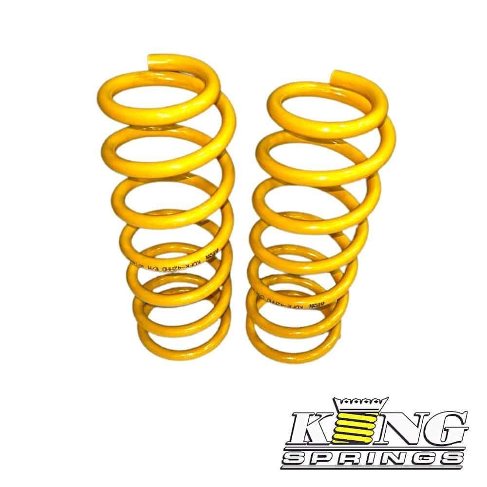 High-quality yellow coil springs for automotive suspension systems from Al Shiba General Trading. Du.