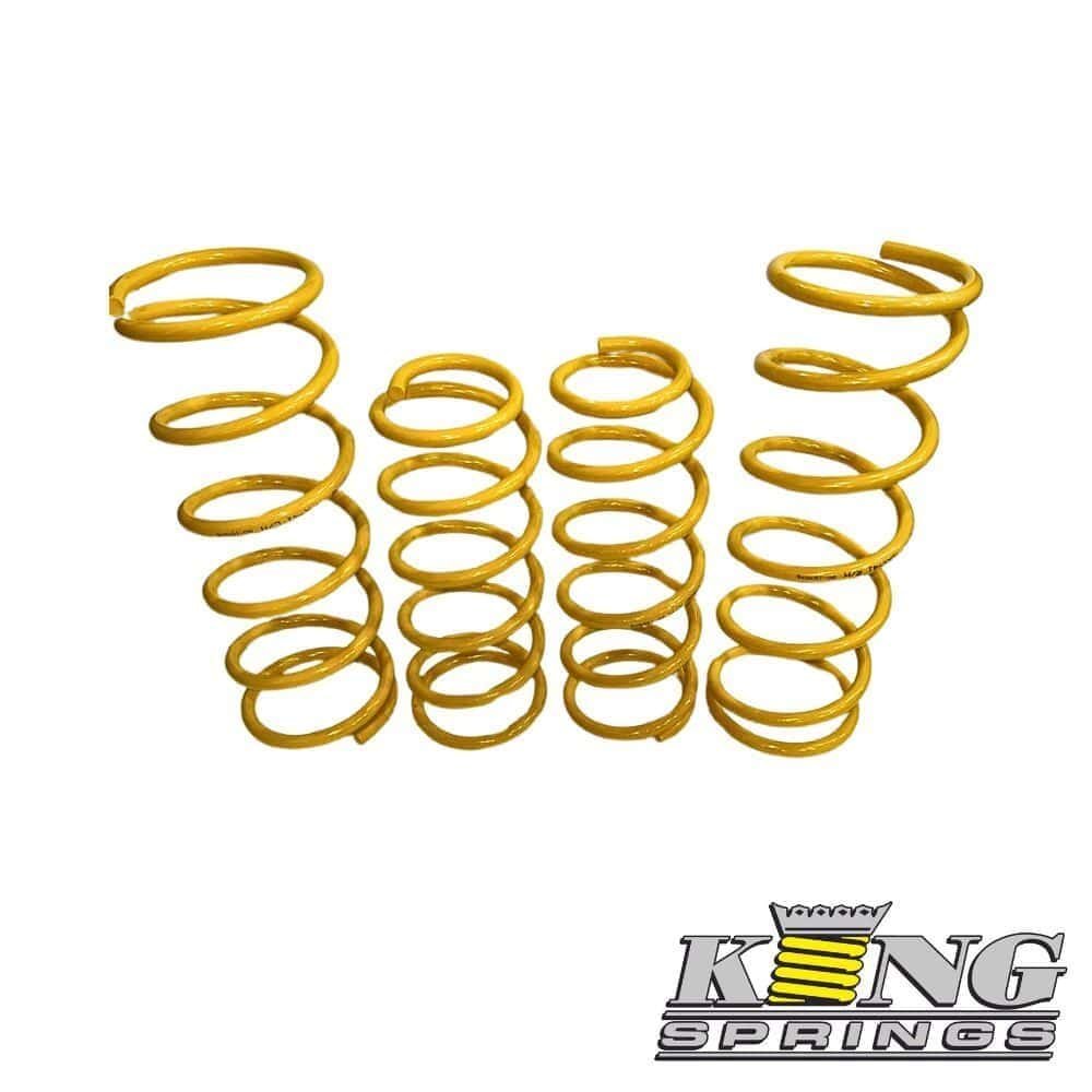Yellow coil springs for industrial or automotive use, arranged in a row.