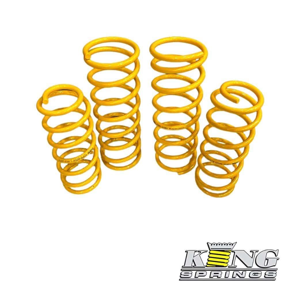 Yellow coil springs for automotive suspension, high-quality and durable.