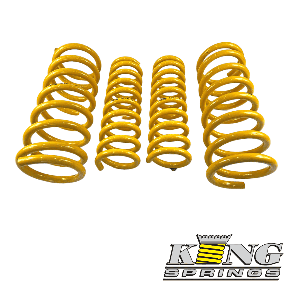 Yellow coil springs for automotive suspension from Al Shiba General Trading.