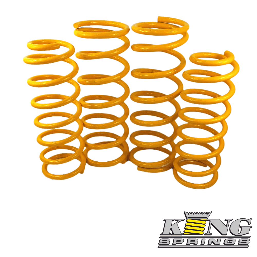 Yellow coil springs for industrial or automotive use, arranged in a group.