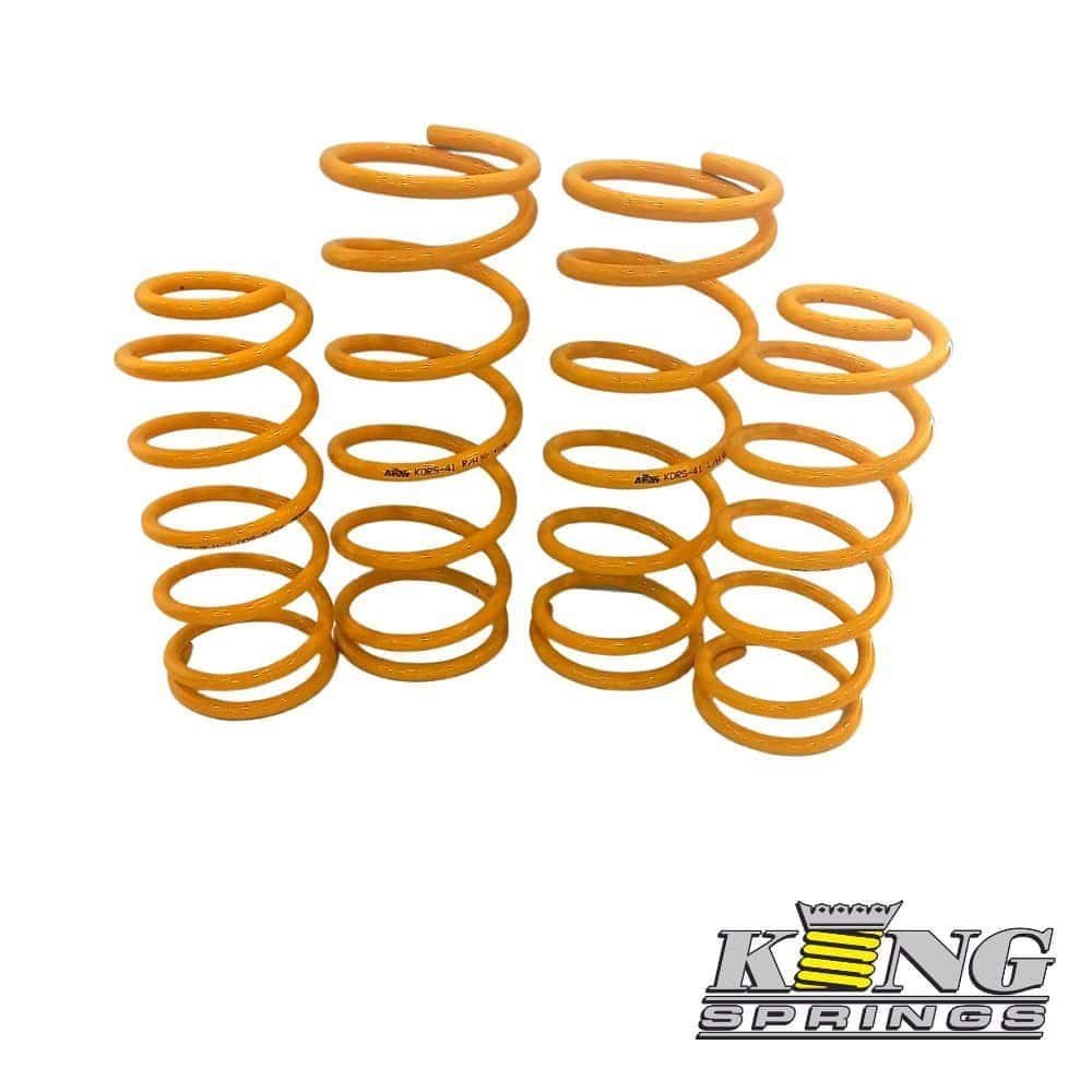 Orange coil springs for industrial or automotive use.